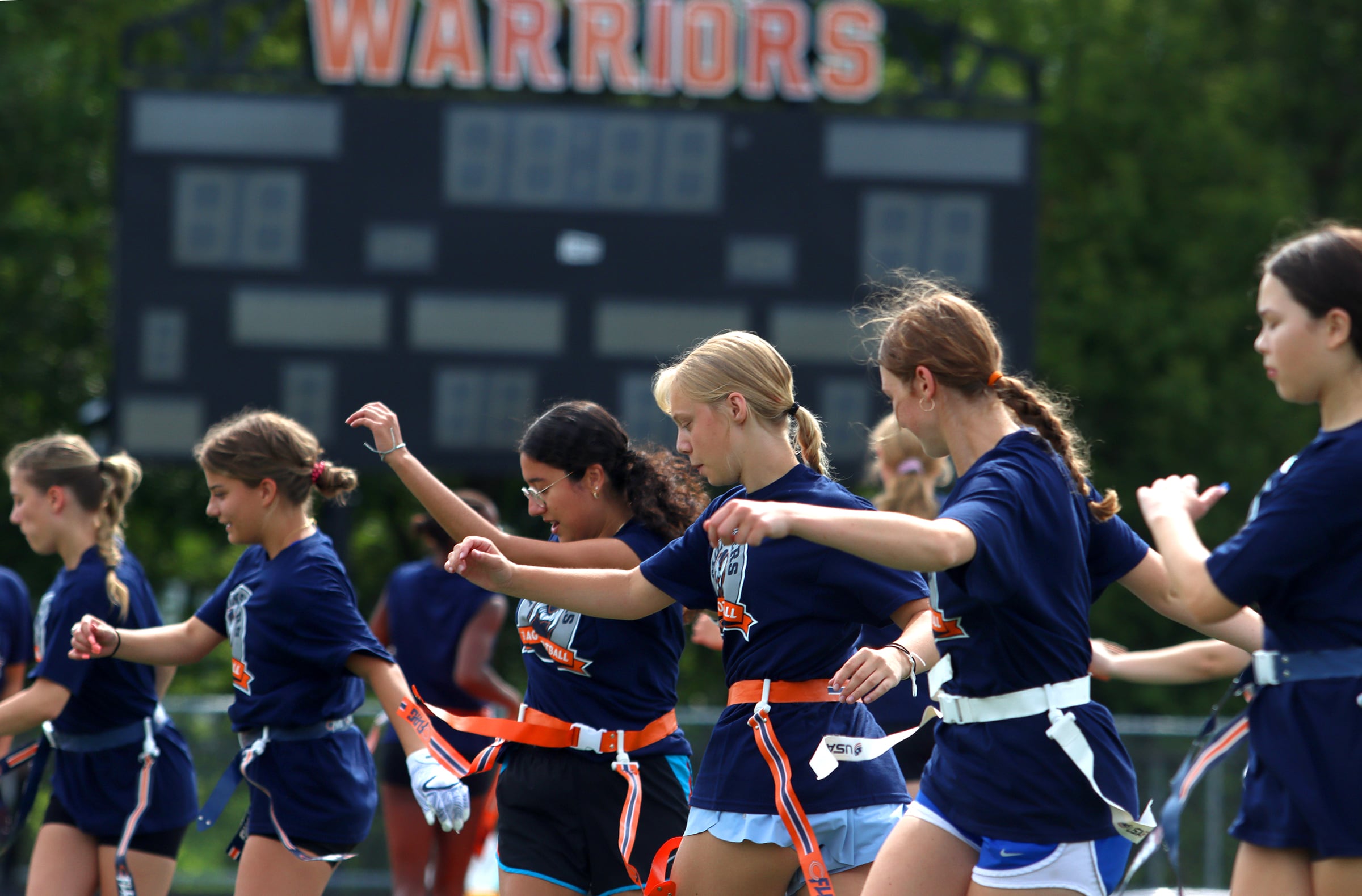 Athletes run through drills as the Chicago Bears and McHenry Community High School hosted a flag football clinic at McCracken Field Wednesday, July 31, 2024.