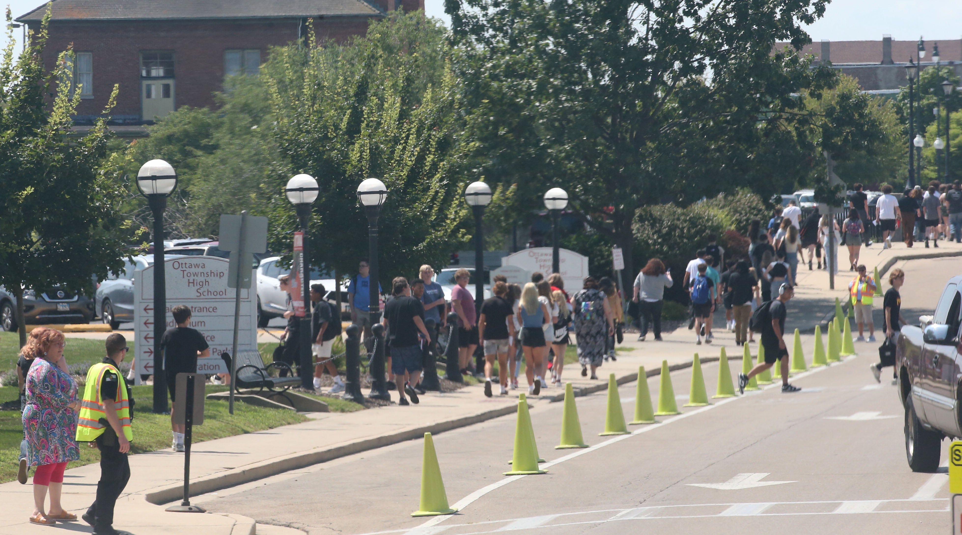 Students exit Ottawa High School on the first day of school on Thursday, Aug. 8, 2024.