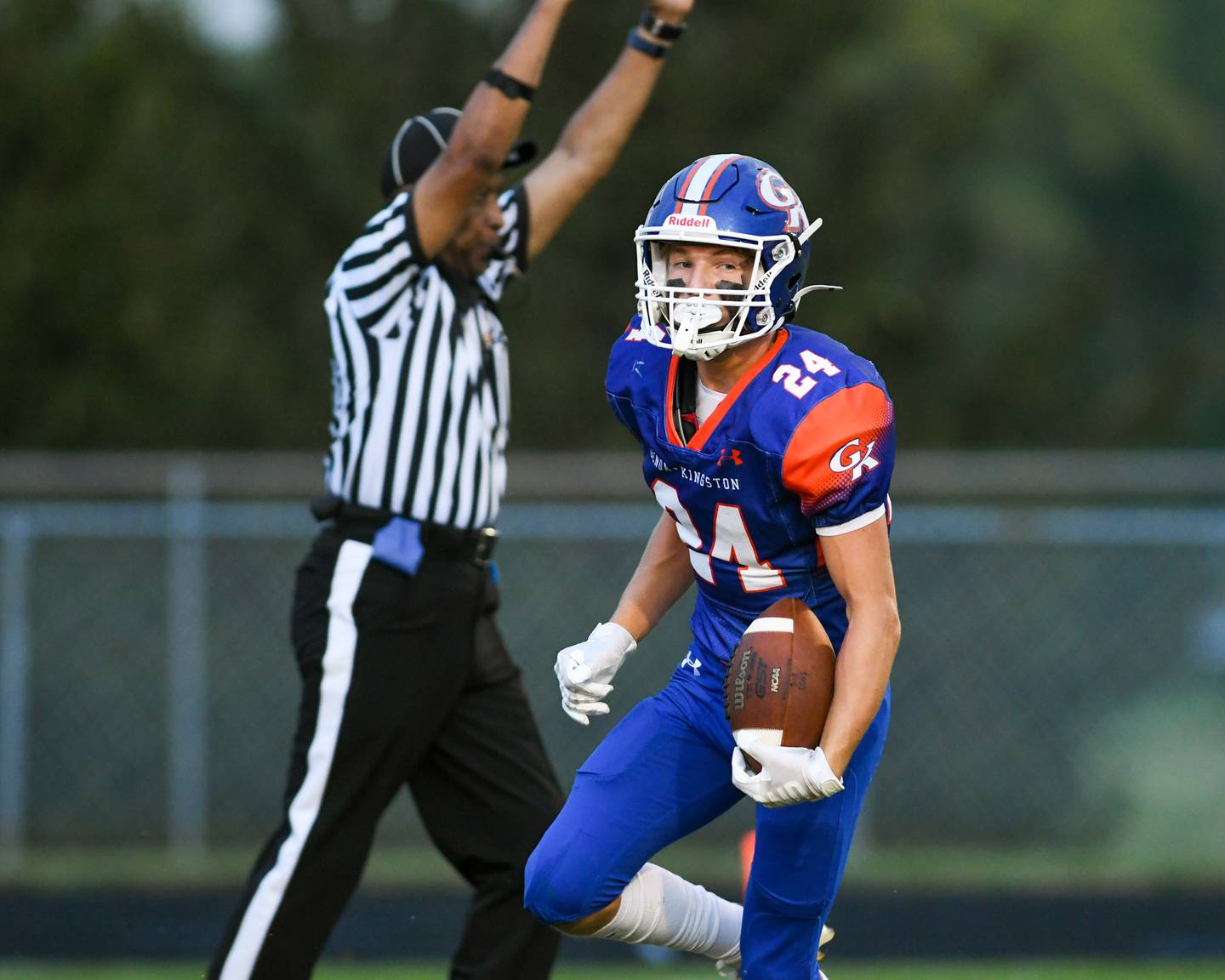 Genoa-Kingston's Patrick Young (24) runs in for a touchdown after catching a pass from teammate Genoa-Kingston's Nathan Kleba (8) during the first quarter of the game on Friday Aug. 30, 2024, while taking on Leo High School held at Genoa-Kingston High School.