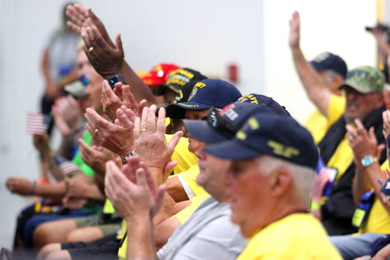 Veterans react as McHenry Community High School hosted a celebration Sunday for veterans returning from an Honor Flight trip to Washington D.C. The Honor Flight trip was coordinated by the Veterans Network Committee of Northern Illinois.