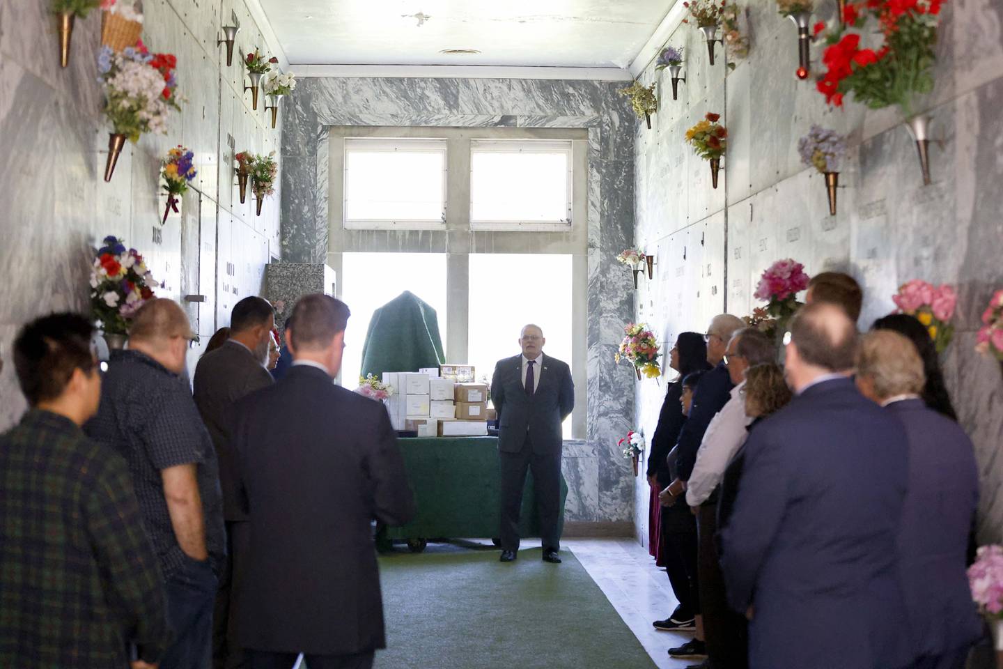 Kane County Coroner Rob Russell speaks to those assembled during a ceremony for the entombment of unclaimed bodies Thursday May 30, 2024 at the St. Charles Township North Cemetery.