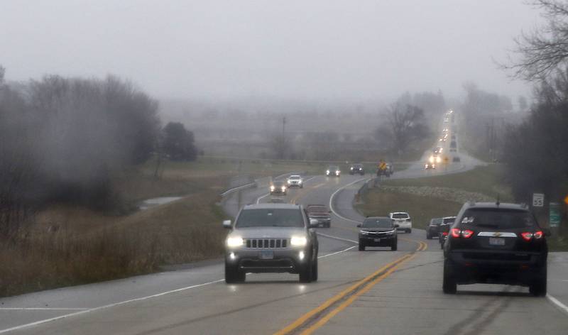 Motorists drive in the mist and rain on Tuesday, April 4, 2023, on Route 47 between Woodstock and Huntley.