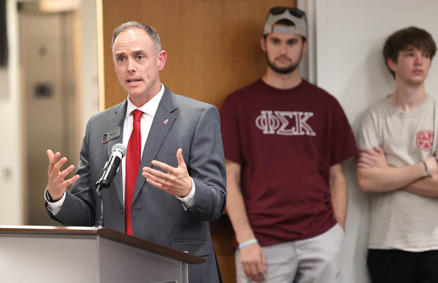 Matt Streb, chief of staff to the president and professor of political science at Northern Illinois University, speaks Monday, July 10, 2023, during the DeKalb City Council meeting about what the proposed NIU Center for Greek Life would offer to the neighborhood around West Hillcrest Drive and Blackhawk Road. The council passed a resolution to enter into a redevelopment agreement with the NIU Foundation for the development of the NIU Center for Greek Life.