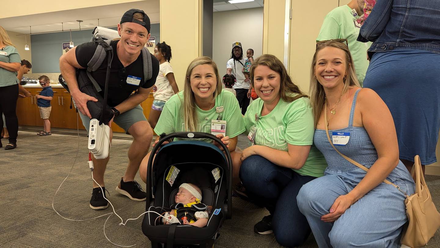 On Sunday, Silver Cross Hospital in New Lenox held its very first reunion of Amy, Matthew and Jay Vana Neonatal Intensive Care Unit graduates and the babies’ immediate families. Pictured behind Sadie Spratt napping in her car seat are (from left) are Dillon Spratt, Sadie's father; Angie Arthur, registered nurse nurse at Silver Cross' NICU; Amy Smith, registered nurse at Silver Cross's NICU; and Brittany Spratt, Sadie's mother.