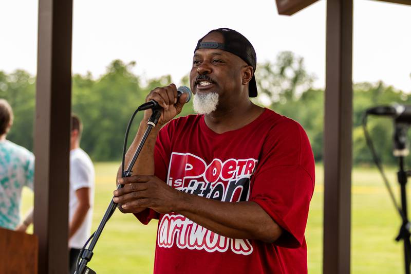 Chicago-based spoken word performing artist Royal Rkitec takes the mic during Lockport Township Park District's Juneteenth Celebration at A.F. Hill Park on June 19, 2024.