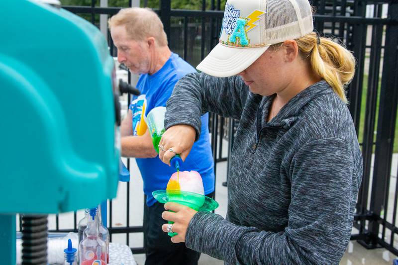 Lexi Kane makes Snow Cone on Tuesday, August 6, 2024 at Riordan Pool in Ottawa.