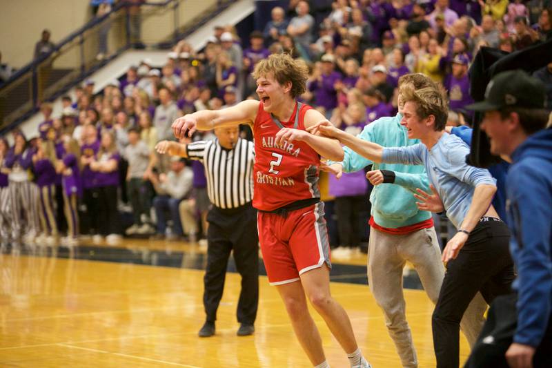 Aurora Christian's Cam Morel celebrates the win over Serena with fans at the Class 1A Boy's Basketball  Super Sectional on Friday , March 1, 2024 at Harvest Christian Academy  in Elgin.