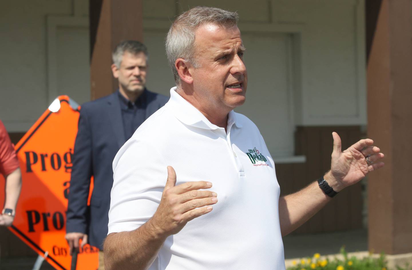 DeKalb Mayor Cohen Barnes speaks during a special meeting of the DeKalb City Council Monday, May 9, 2022, in the parking lot of the former Hillcrest Shopping Center. The meeting was held to kick off the demolition process of the strip mall on Hillcrest Drive which will begin Tuesday morning.