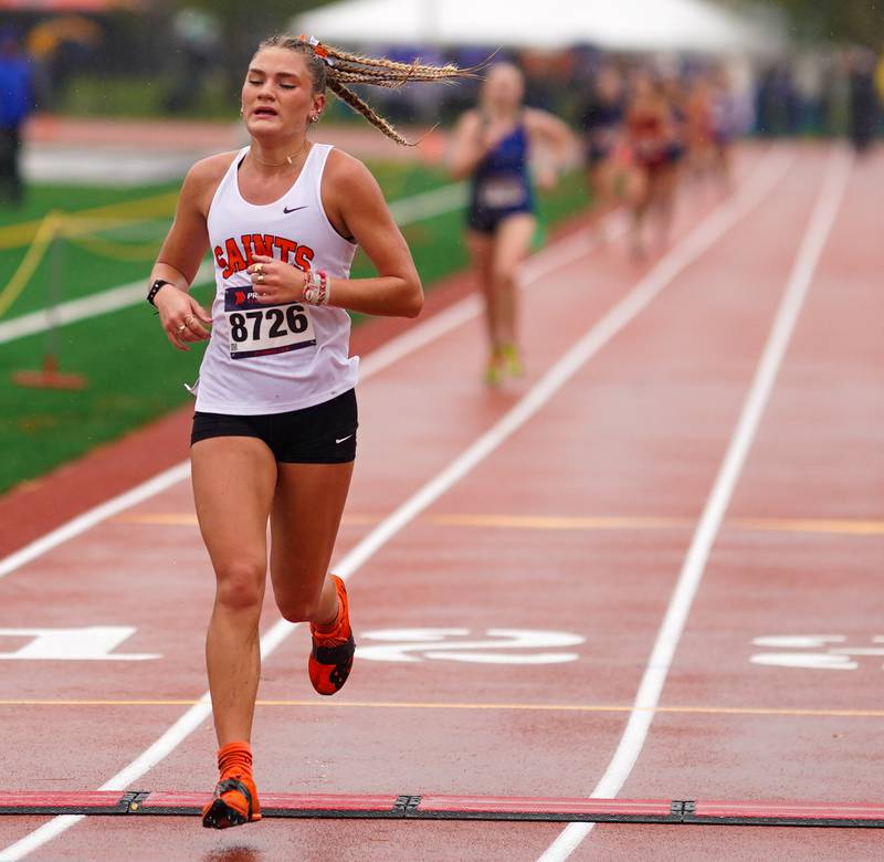 St. Charles East’s Marley Andelman makes her way to the finish line for a fifth place time of 18:51.2 during the DuKane Conference Cross Country Championships at Lake Park High School in Roselle on Saturday, Oct. 14, 2023.