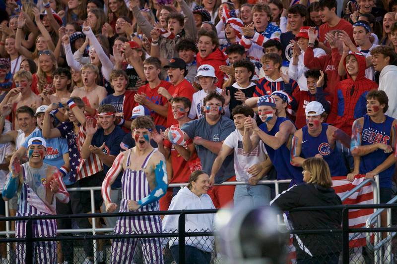 Downers Grove North students cheer on Downers Grove North as they play against Downers Grove South on Friday Sept. 6,2024 in Downers Grove.