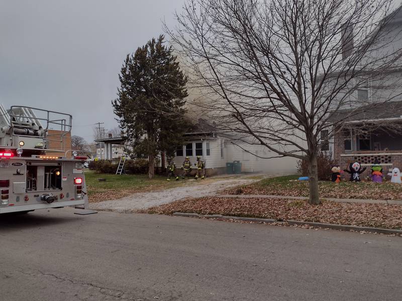 Smoke billows behind the house at 504 S. Bloomington St. in Streator that caught fire Monday, Nov. 20, 2023.