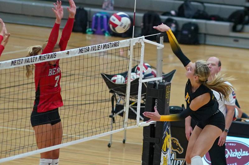 Metea Valley's Maddie Hopkins (11) goes up for a kill attempt against Benet during a volleyball match at Metea Valley High School in Aurora on Wednesday, Sep 4, 2024.