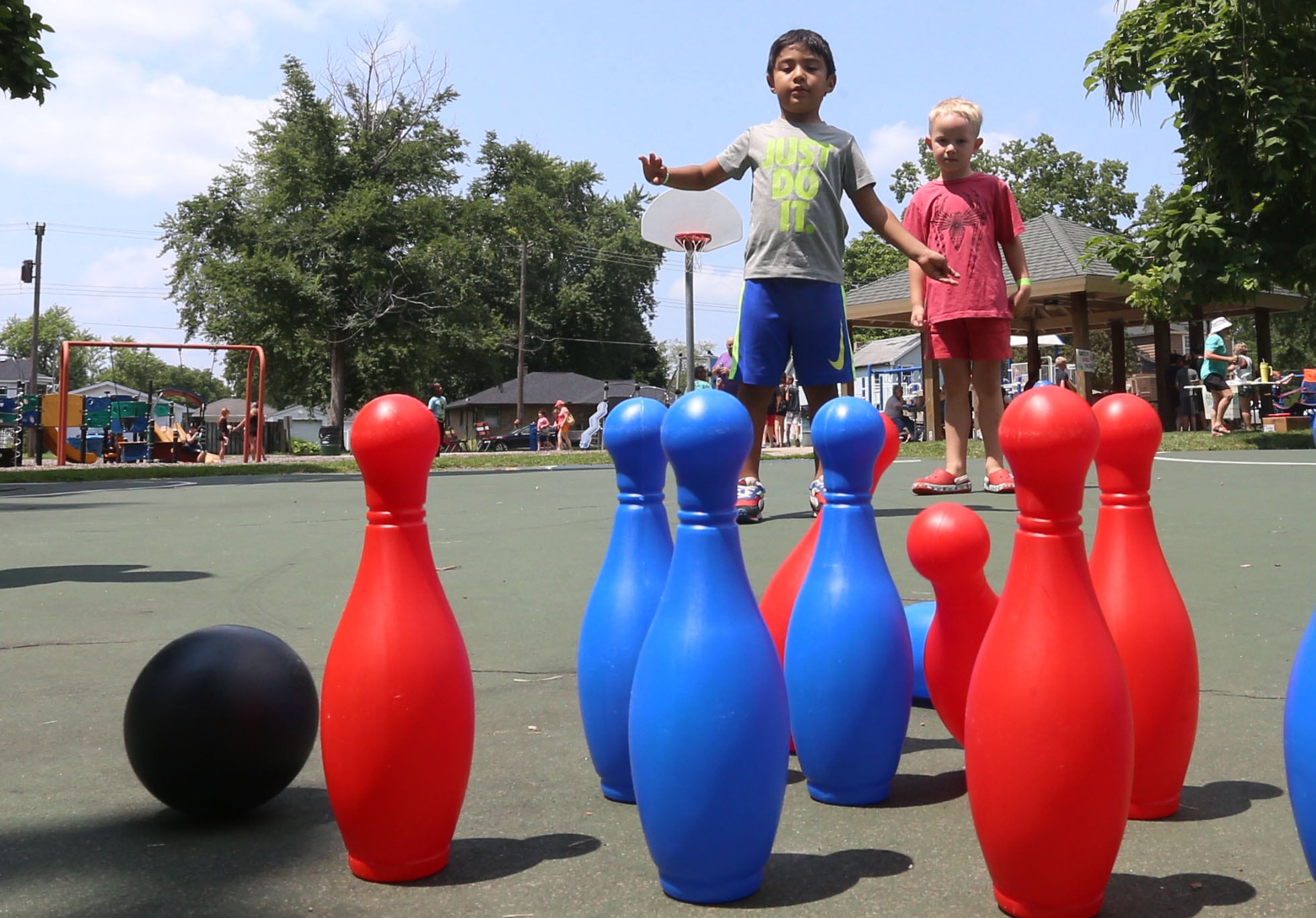 Emmanuel Gutierrez bowls during the Ottawa Recreation Summer Carnival on Wednesday, July 25, 2024 at Rigden Park in Ottawa. The carnival featured games, activities, bounce houses, and more. It wa the last event of the season.