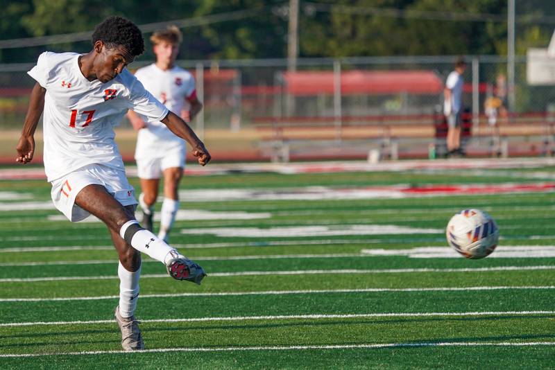 Oswego’s Thomas Marcoux (17) shoots the ball against Yorkville during a soccer match at Yorkville High School on Tuesday, Sep 17, 2024.