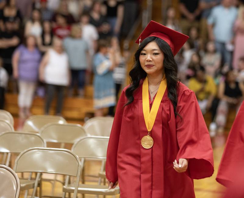 Danielle Giacinto makes her way to her seat Sunday, May 19, 2024, at the beginning of Streator High School's graduation.