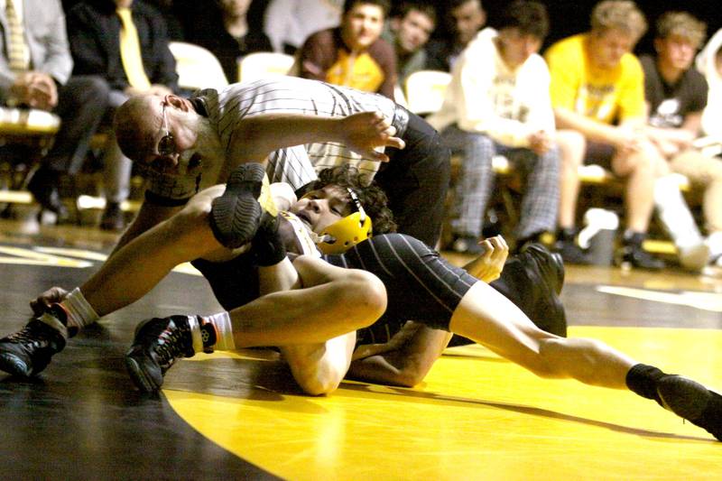 Jacobs’ Ben Arbotante, top, battles Crystal Lake Central’s Payton Ramsey at 113 pounds in varsity wrestling Thursday at Algonquin.