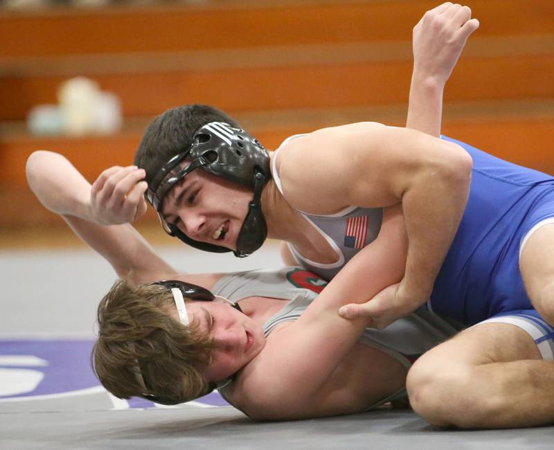 Princeton's Augie Christiansen wrestles L-P's Zach Pocivasek on Thursday, Jan. 19, 2023 at Princeton High School.