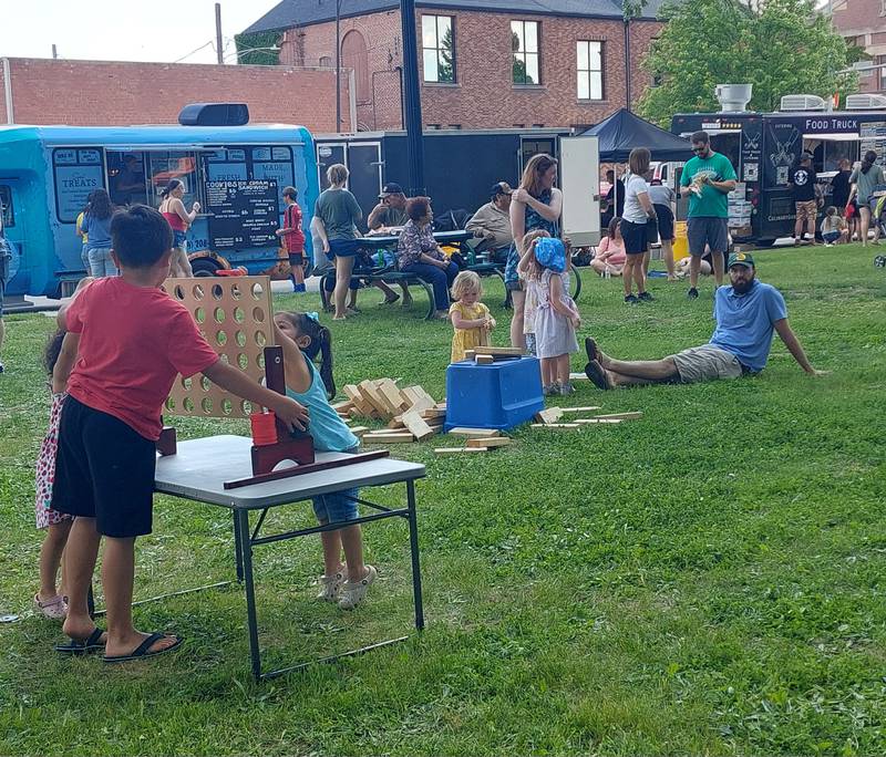 Families took part in yard games Saturday, May 18, 2024, at the Streator Food Truck Festival in City Park.