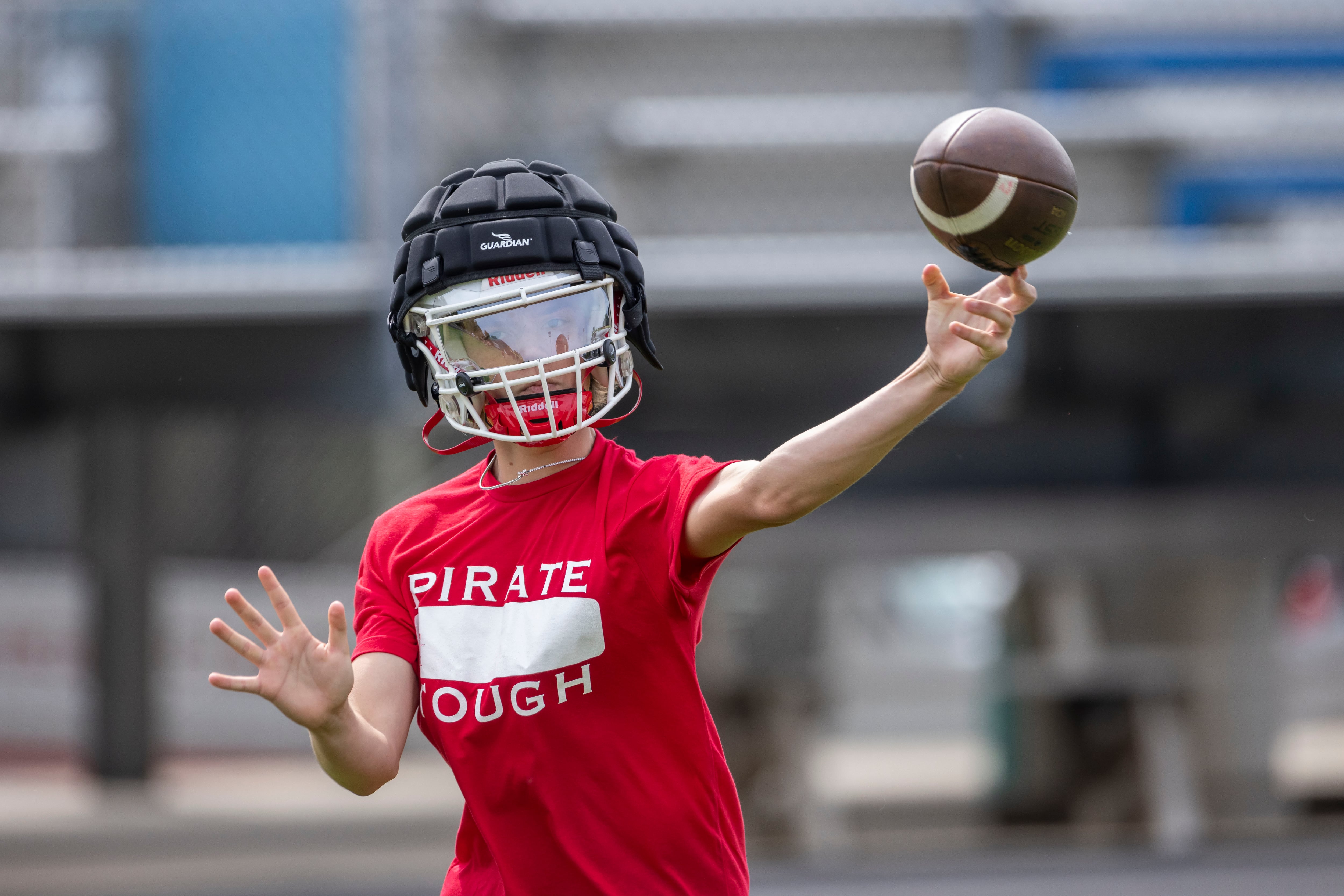 Ottawa High School quarterback Mark Munson warms up prior to the first of several matches against other schools during a multiple high school practice football meet at Princeton High School on July 20, 2024.