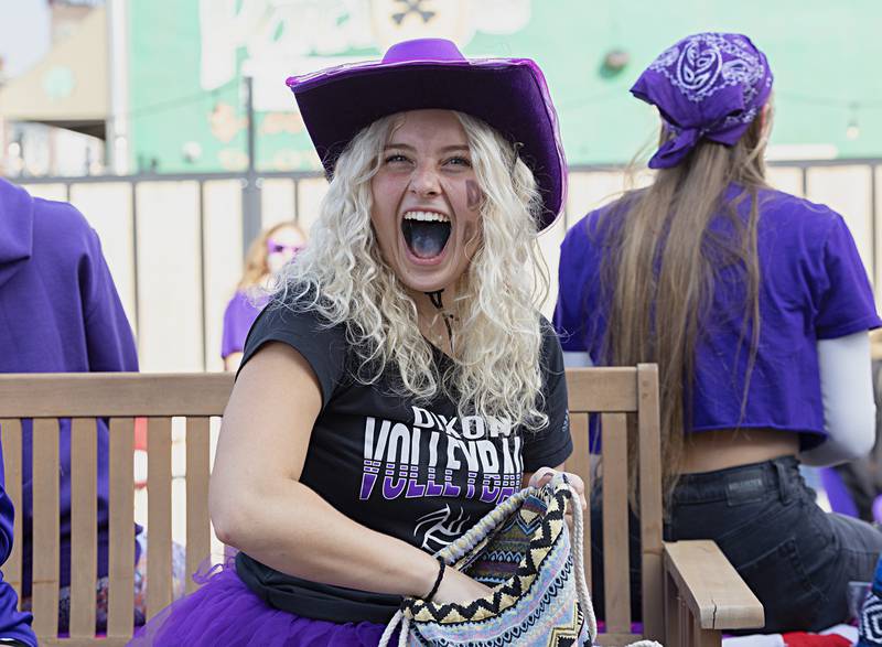 Dixon volleyball’s Emma Olson smiles from the float Friday, Sept. 29, 2023 during the Dixon homecoming parade.