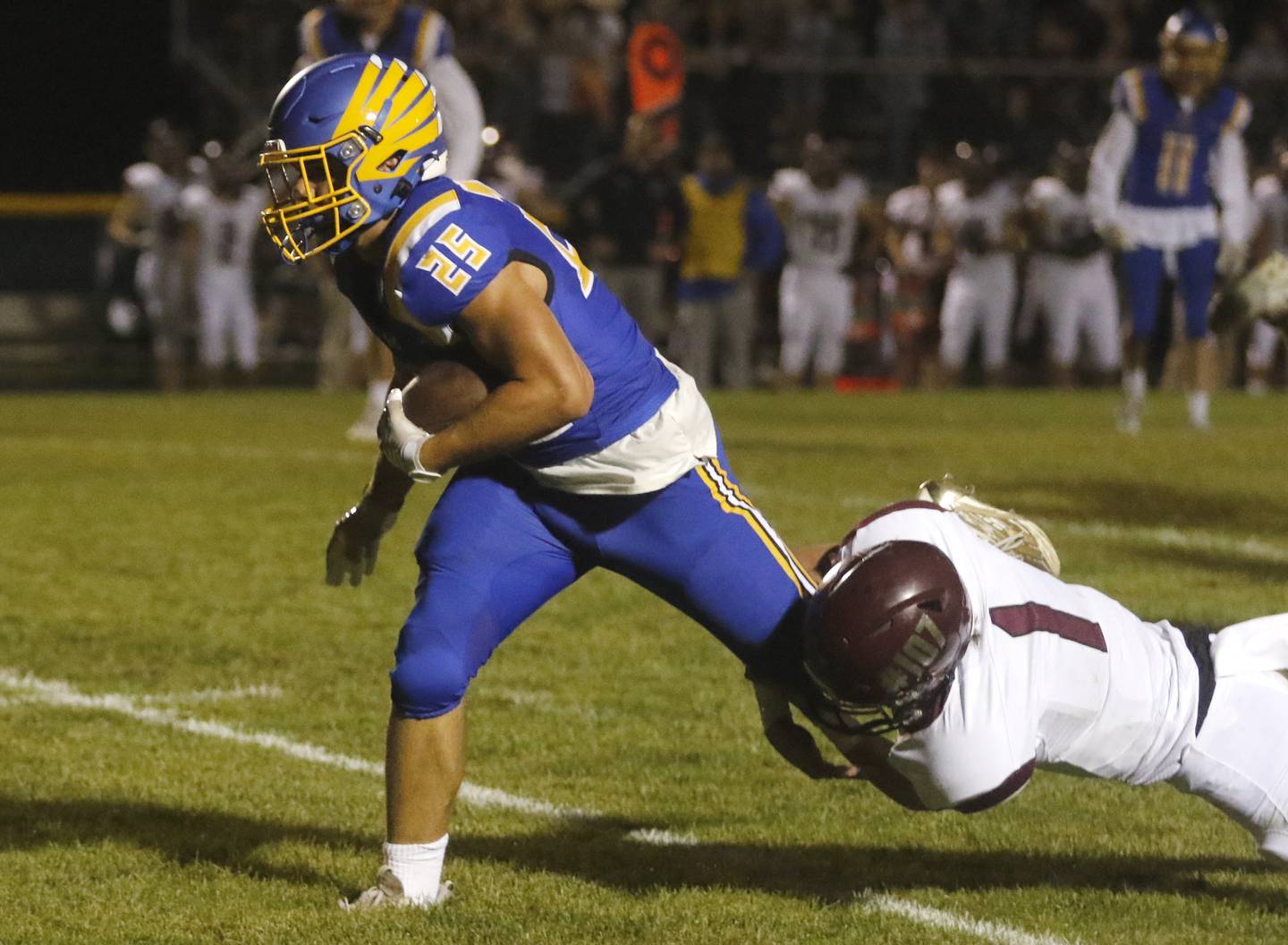 Johnsburg's Brett Centnarowicz tries to get out of the grasp of Marengo’s David Lopez during a Kishwaukee River Conference football game on Friday, Sept. 15, 2023, at Johnsburg High School.