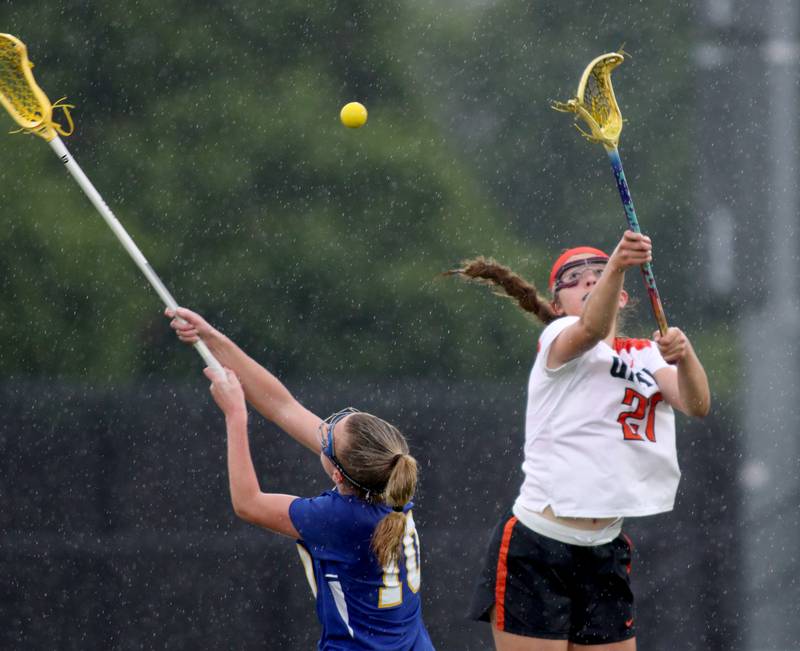 Crystal Lake Central’s Anna Starr, right, and Lake Forest’s Maeve Farrell battle for the ball during girls lacrosse supersectional action at Metcalf Field on the campus of Crystal Lake Central Tuesday.