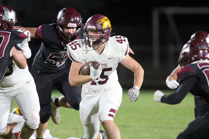 Richmond Burton’s Riley Shea runs the ball in varsity football at Rod Poppe Field on the campus of Marengo High School in Marengo on Friday, Oct. 18, 2024.