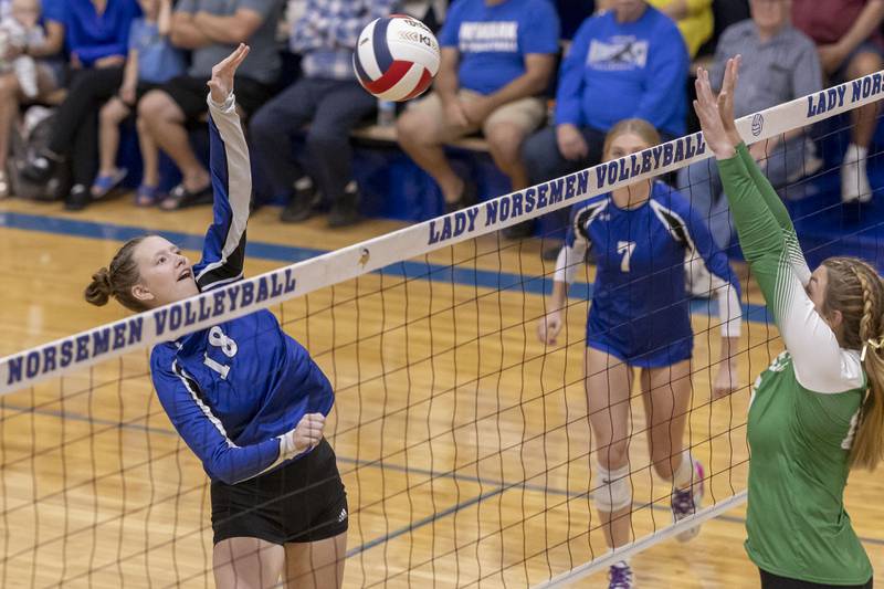 Newark's Olivia Smith strikes the ball over the net during the match against Seneca at Newark High School on September 9, 2024.