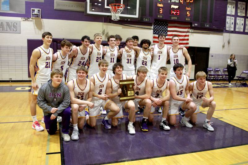 Downers Grove North players pose with their plaque following their Class 4A Downers Grove North Regional final win over Neuqua Valley on Friday, Feb. 23, 2024.