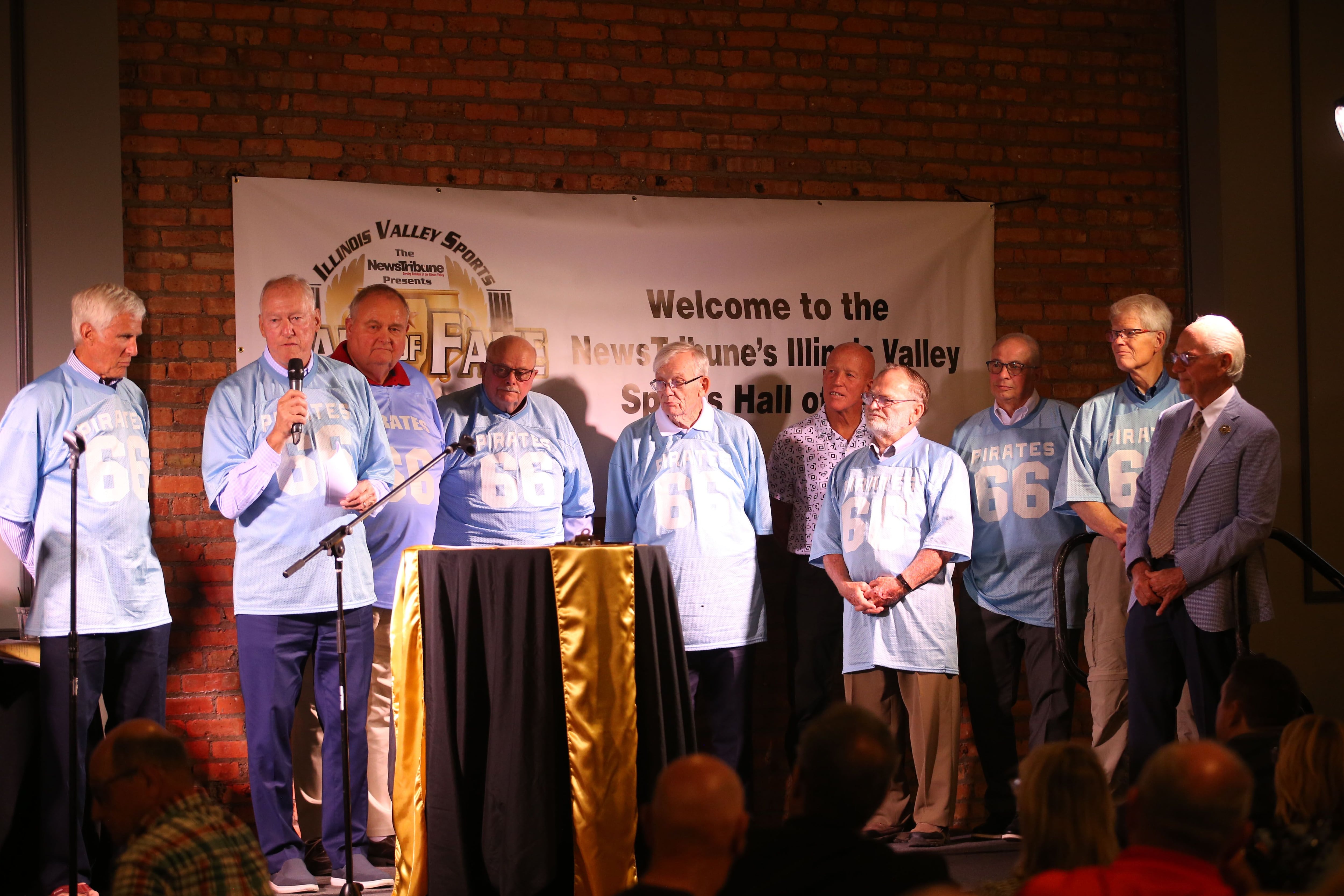 Members of the 1966 Ottawa Township High School football team speak during the Shaw Media Illinois Valley Sports Hall of Fame on Thursday, June 8, 2023 at the Auditorium Ballroom in La Salle. 