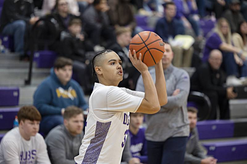 Dixon’s Darius Harrington puts up a three-pointer Monday, Dec. 5, 2022 in a game against Rochelle.