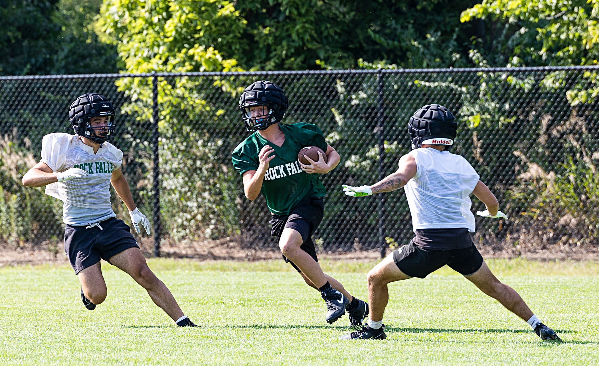 Rock Falls’ Koltyn Stombaugh runs back a kick Tuesday, Aug. 13, 2024 during practice. Illinois football teams started practice this week for the 2024 season.