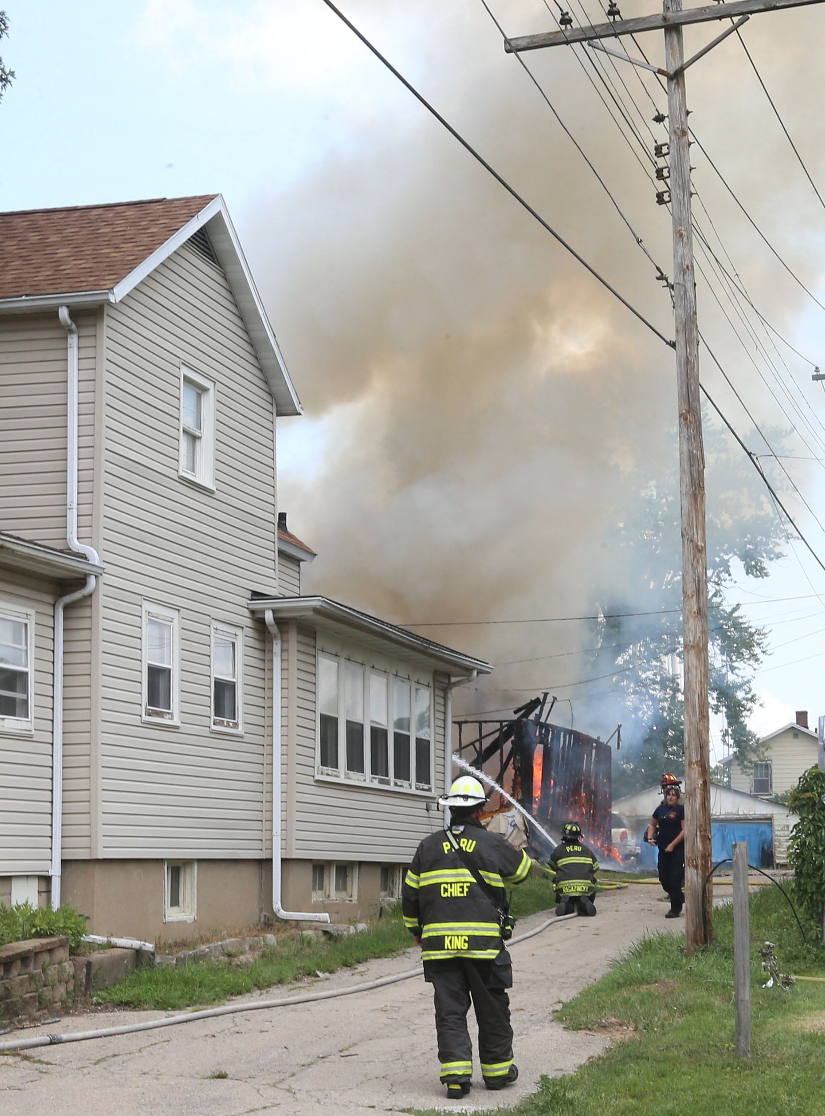 Peru Fire chief Jeff King arrives to the scene of a garage fire in the 800 block of Lafayette Street on Monday, July 22, 2024. The fire began just before 1p.m. La Salle Fire and EMS along with Peru Fire department responded to the call while La Salle Police directed traffic.