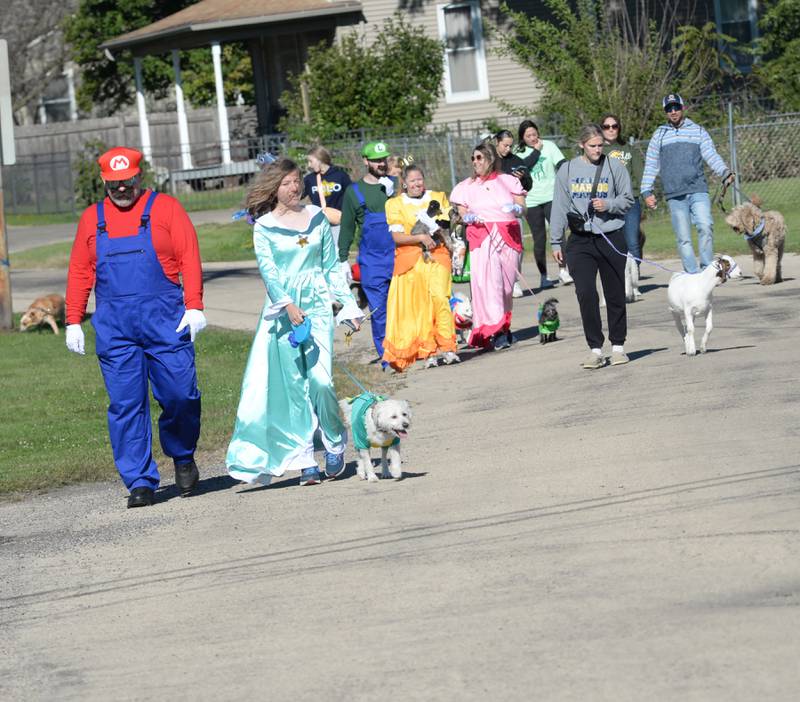 Participants in Polo High School's 2024 Doggy Dash finish the 1-mile walk on Saturday, Sept. 7, 2024. The event, organized and run by Polo High School's student council, raised $500 for the Happy Trails Humane Society in Rock Falls. It also included a costume contest