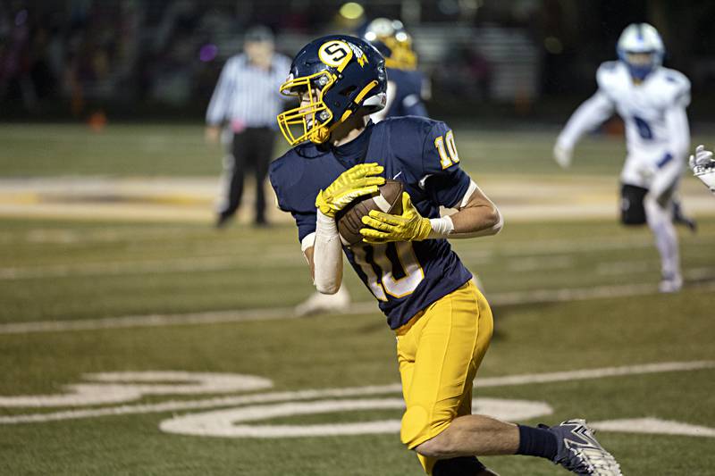 Sterling's Dylan Ottens takes a pass and picks up yards against Quincy Friday, Oct.6, 2023 in Sterling.