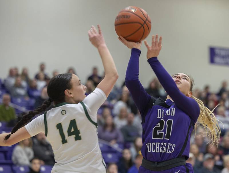 Dixon’s Reese Dambman puts up a shot over Boylan’s Mary Rose Friday, Feb. 16, 2024 at the class 3A Rochelle girls basketball regional.