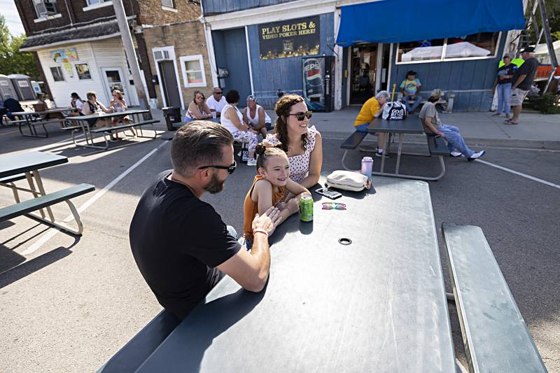 Joshua Smith with wife Alisha and daughter Everleigh, 7, of Rock Falls listen to the music at Dement Town Music Fest Saturday, Sept. 2, 2023 in Dixon. Music ran from 3 pm to 9 pm.