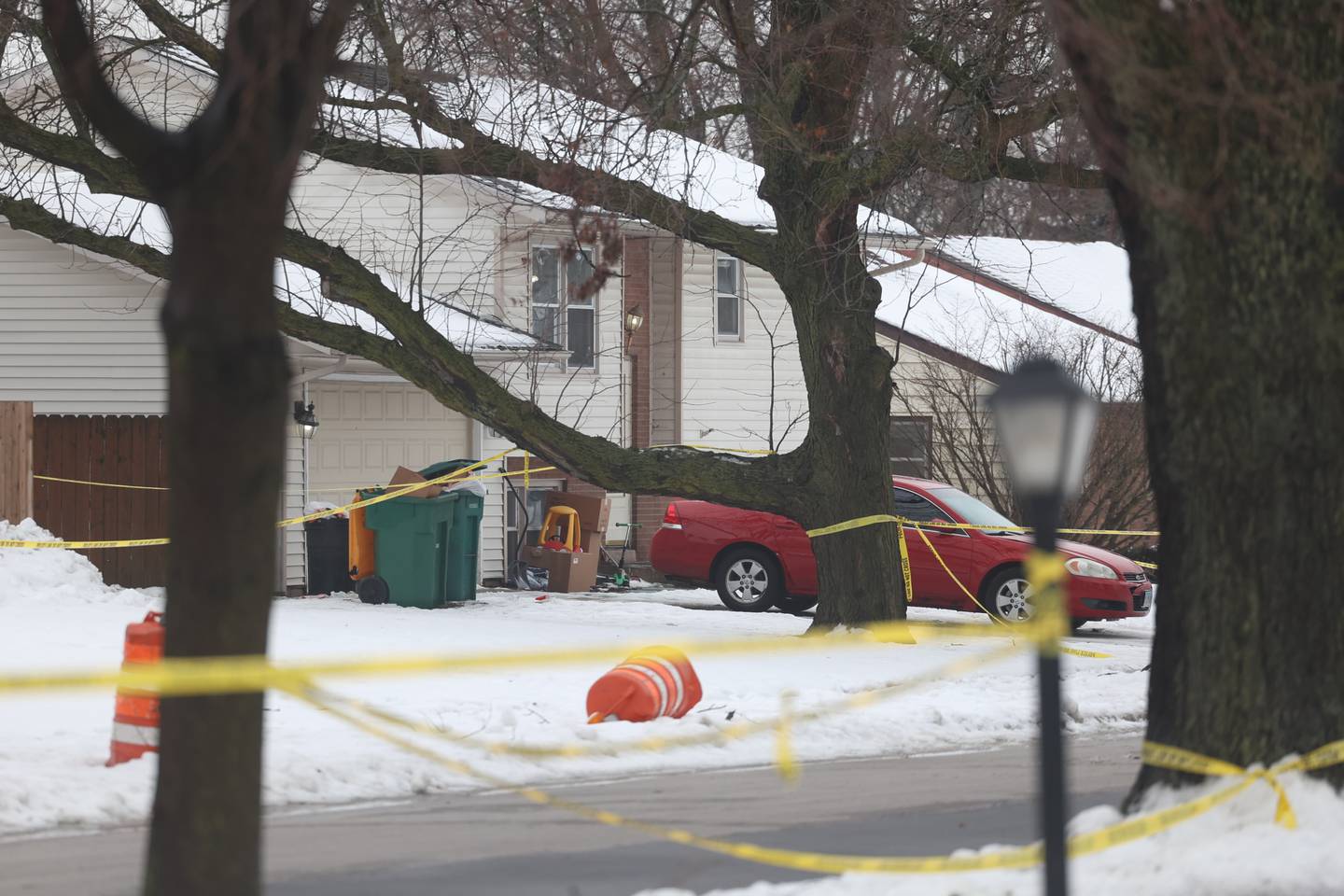 One of the homes along 2200 West Acres where several victims were found shot remains taped up on Tuesday, Jan. 23rd in Joliet.