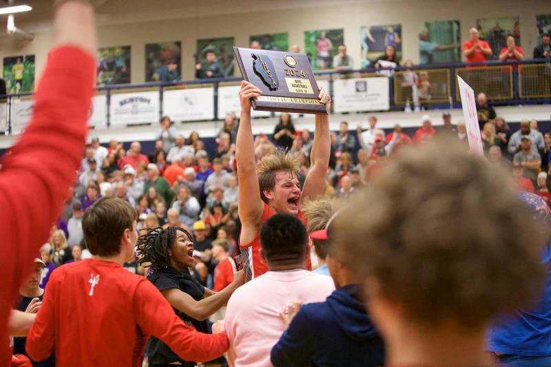 Aurora Christian's Cam Morel and team celebrate the win over Serena at the Class 1A Boy's Basketball  Super Sectional on Friday , March 1, 2024 at Harvest Christian Academy  in Elgin.