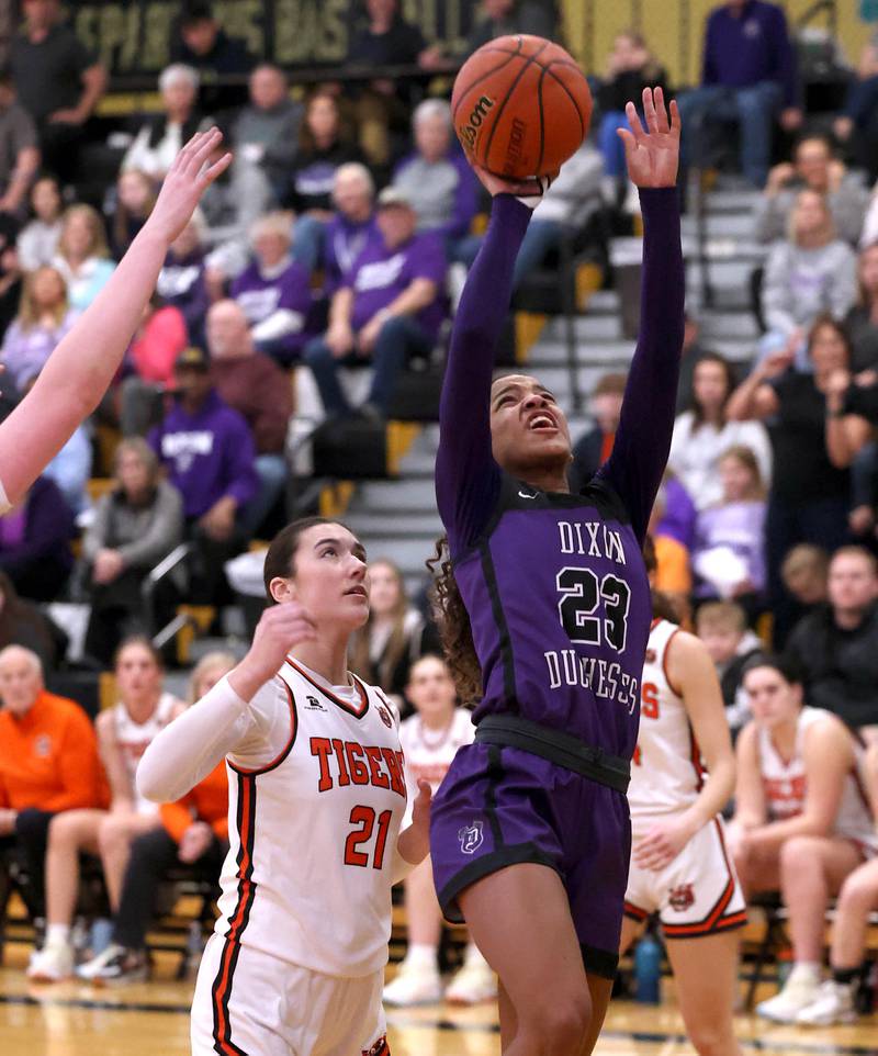 Crystal Lake Central's Ruby Macke (left) and Katie Hamill go after a rebound against Dixon’s Reese Dambman (second from left) and Ahmyrie McGowan during their Class 3A sectional semifinal Tuesday, Feb. 20, 2024, at Sycamore High School.