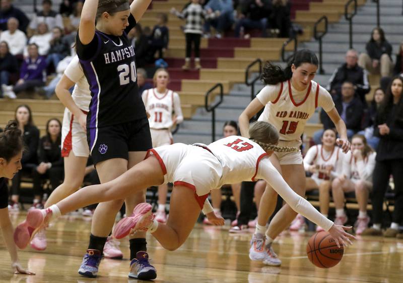 Huntley's Morgan McCaughn dives a she tries to save the from going out of bounds in front of Hampshire's Chloe Van horn and Huntley's Jessica Ozzauto during a Fox Valley Conference girls basketball game Monday, Jan. 30, 2023, at Huntley High School.