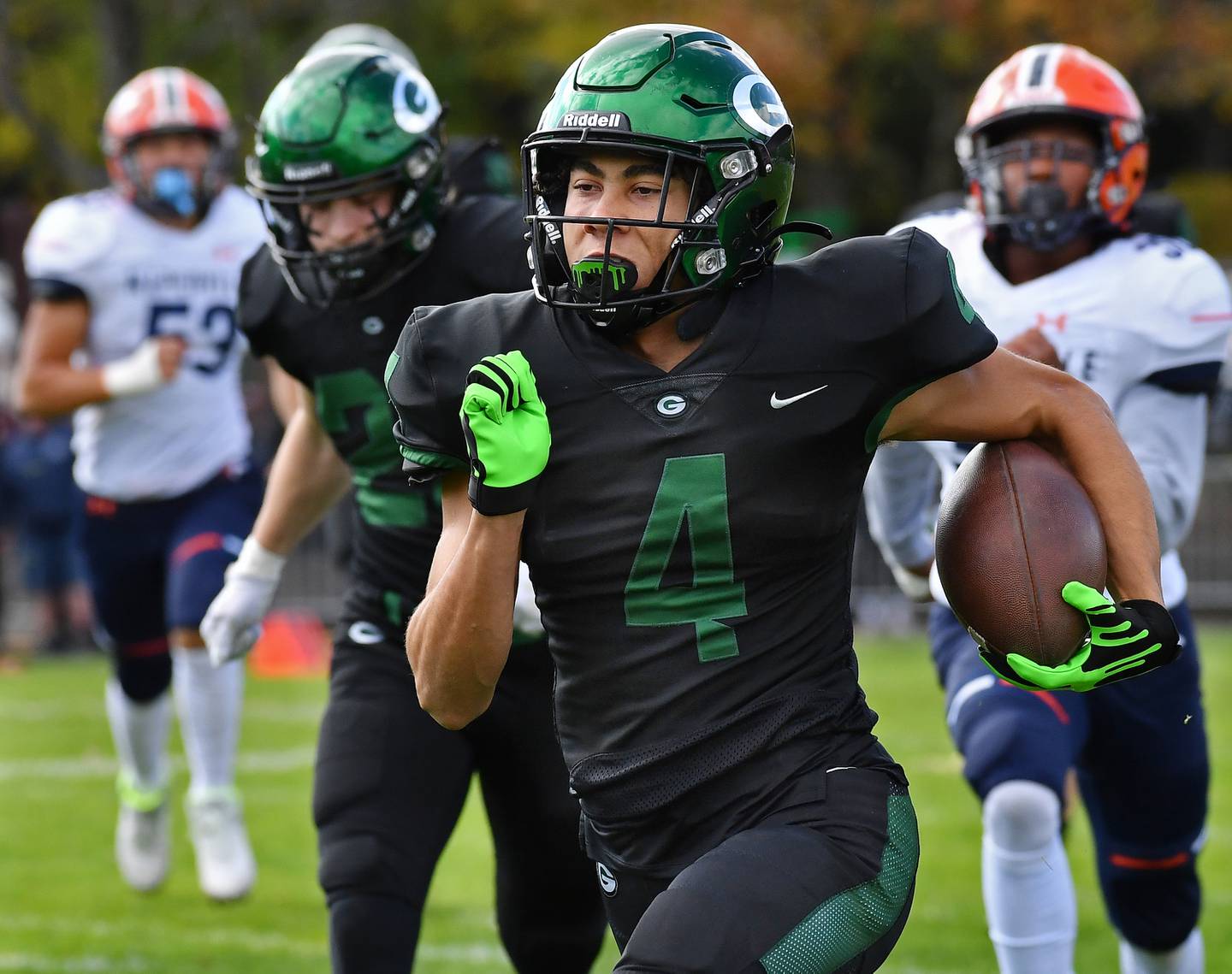 Glenbard West's Mason Ellens returns the game opening kickoff for a touchdown during an IHSA Class 8A playoff game against Naperville North on Oct. 28, 2023 at Glenbard West High School in Glen Ellyn.