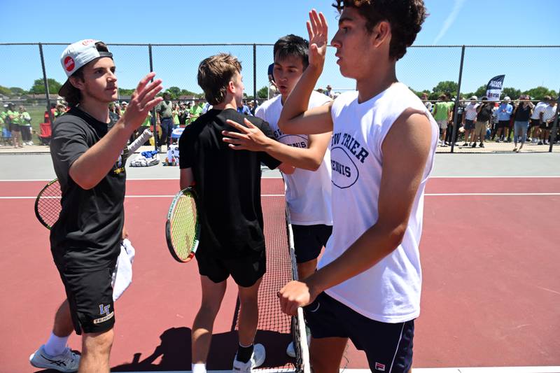 Left to right, Lyons Township’s Mason Mazzone and Jack McLane shake hands with New Trier’s Chris Ackerman and Jovan Morales, who won 4-6, 6-1, 6-2 in the Class 2A doubles championship match of the boys state tennis tournament at Palatine High School on Saturday, May 25, 2024 in Palatine.