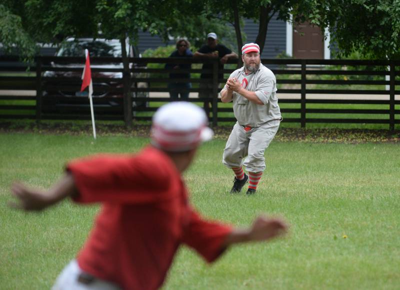 Ganymede Ryan "Morty" Mortlock looks to throw to first for an out during a vintage base ball game against the DuPage Plowboys at the John Deere Historic Site in Grand Detour on Saturday, June 8, 2024.