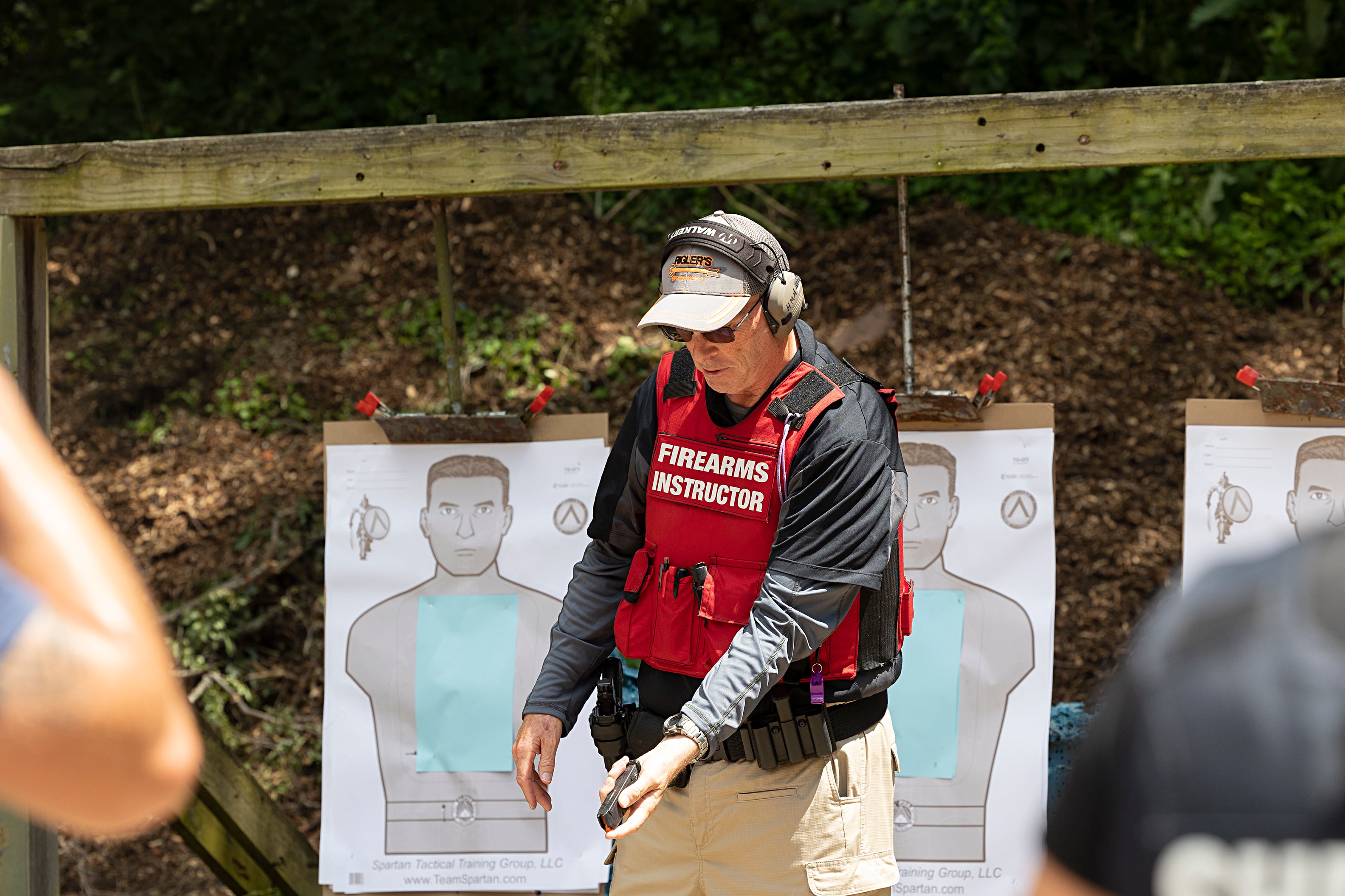 Range instructor Howard Malachi takes Sauk Valley Police Academy recruits through the steps of tactical reloading Wednesday, July 17, 2024, while on range in Dixon.