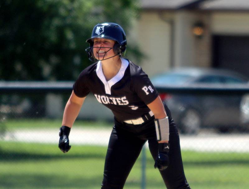 Prairie Ridge’s Autumn Ledgerwood howls with delight after reaching second base safely against Harvard during Class 3A softball regional final action at Lions Park in Harvard Saturday.