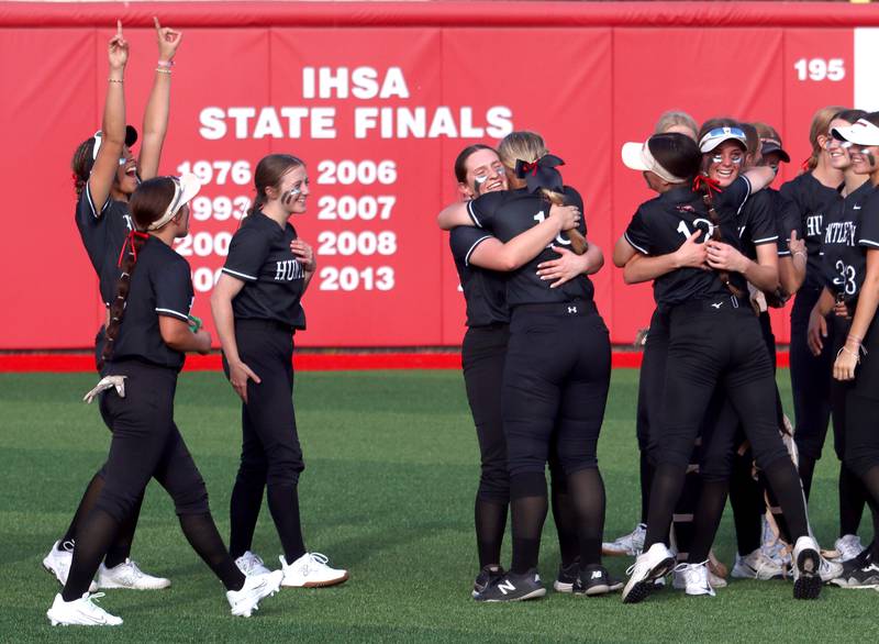 Huntley’s Red Raiders celebrate a win over Barrington in sectional final softball action at Barrington Friday.