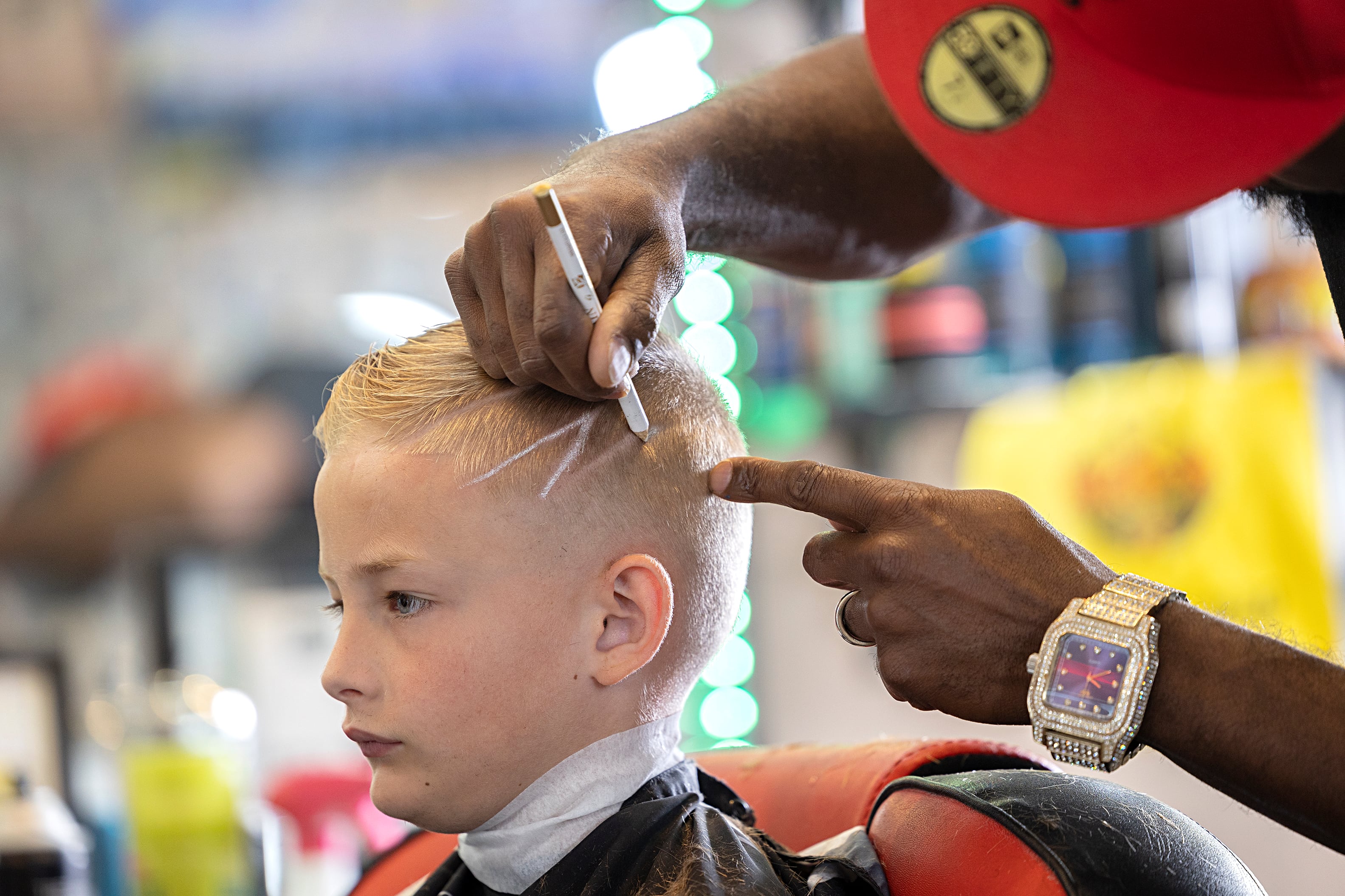 Ben Phillips gives Colton Lee a little pizzazz in his new cut Tuesday, July 30, 2024.