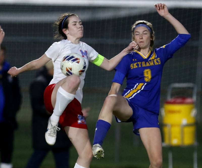 Marian Central'a Mary Keane tries to control the ball infant of Johnsburg's Wynne Oeffling during the IHSA Class 1A Marengo Regional championship soccer match on Tuesday, May 14, 2024, at Marengo High School.