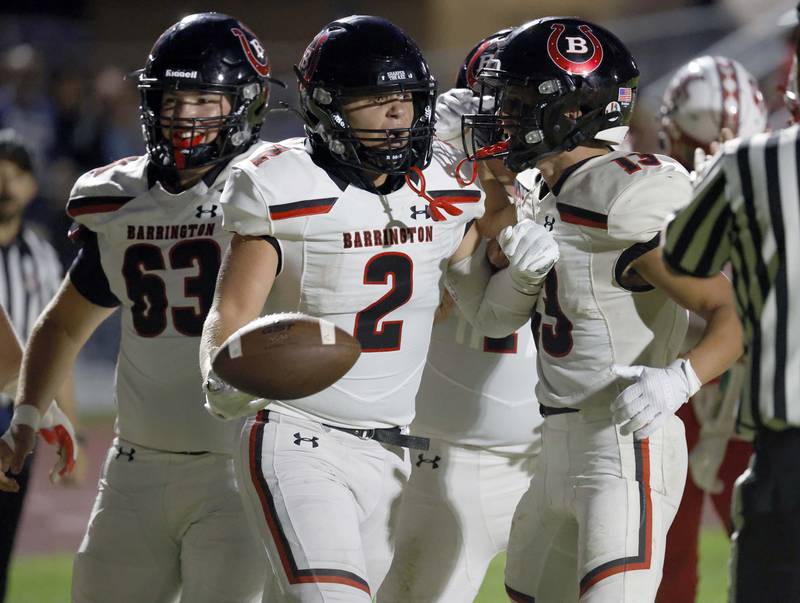 Barrington's Ian Tepas (2) celebrates a touchdown with his teammates Friday, Aug. 30, 2024 in South Elgin.